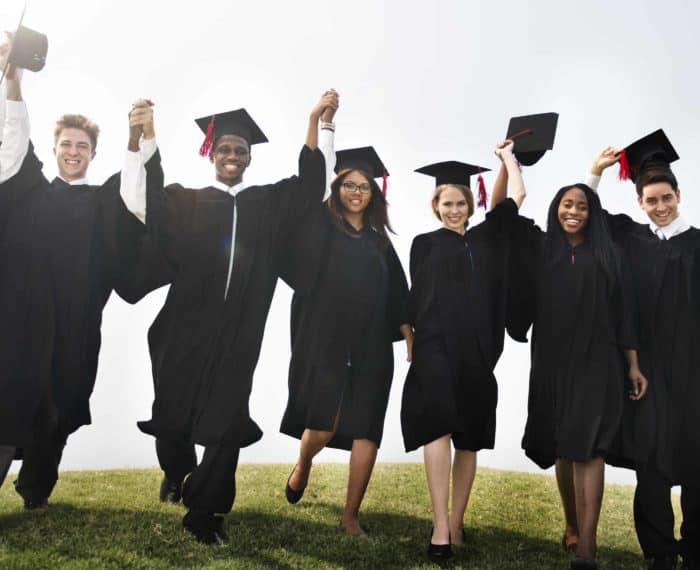 Group Students Hands Raised Graduation Concept