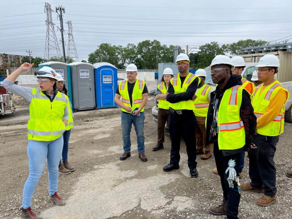 Power Construction and Evanston Rebuilding Warehouse Students at construction site.